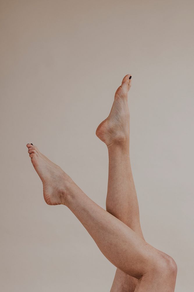 Attractive female legs up in the air photo