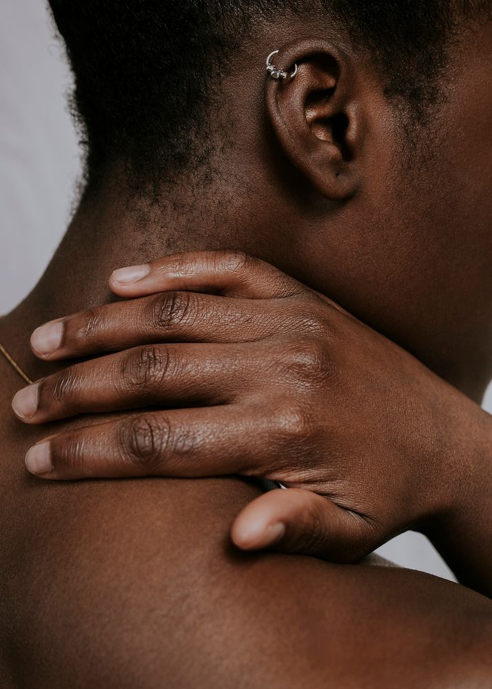 African woman touching neck photo
