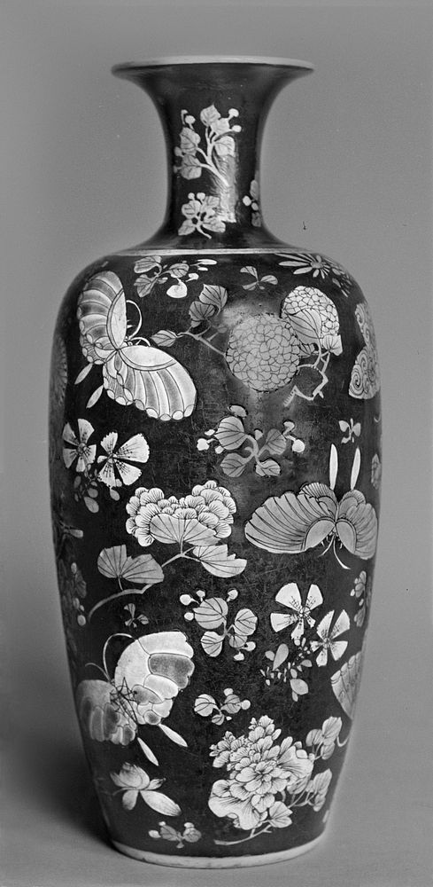 Vase with butterflies and flowers