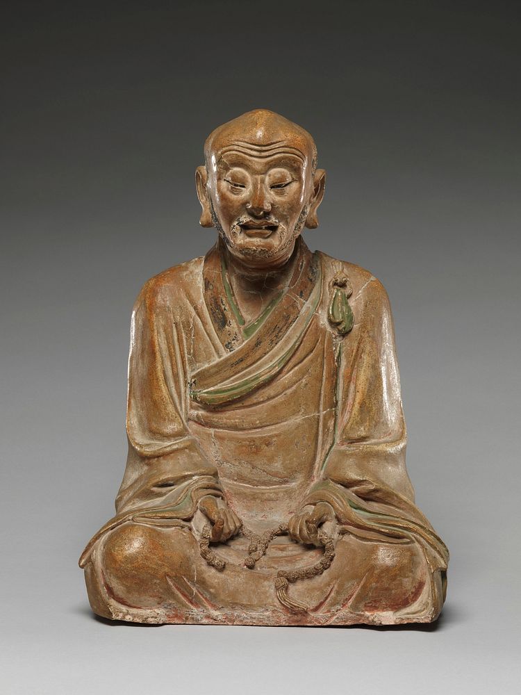 Seated luohan holding a rosary