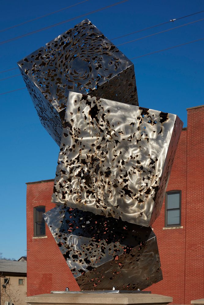                         Bruce White's 2017 sculpture, "Fractal Cluster," which stands on the bridge over the Fox River in…
