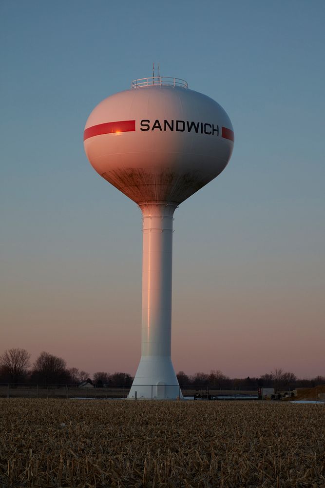                         Water tower in a town with an unusual name: Sandwich, Illinois. The town got its name when prominent…