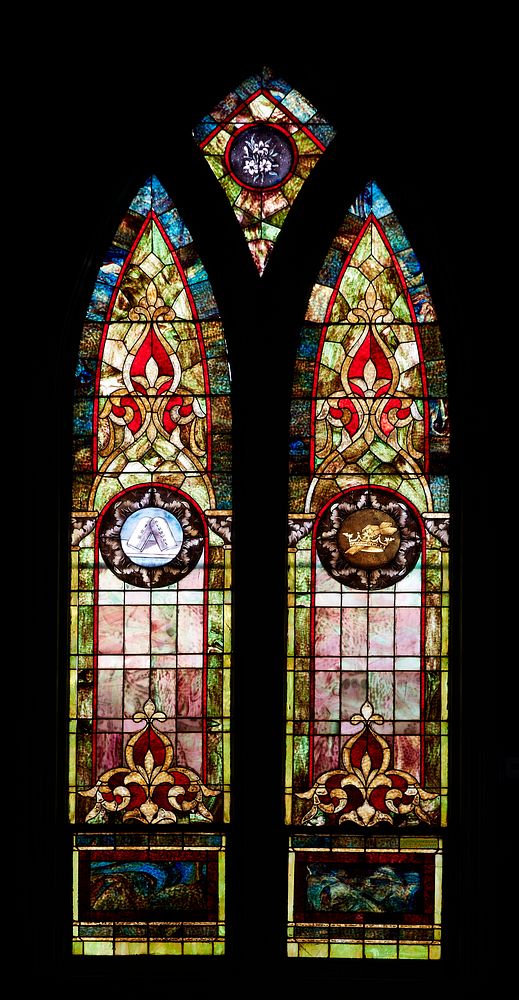                         Stained-glass windows inside Williamson Chapel, adapted from an early schoolhouse to represent small…