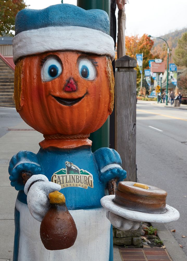                         One of several Thanksgiving-season pumpkin characters makes an appearance on the street in…