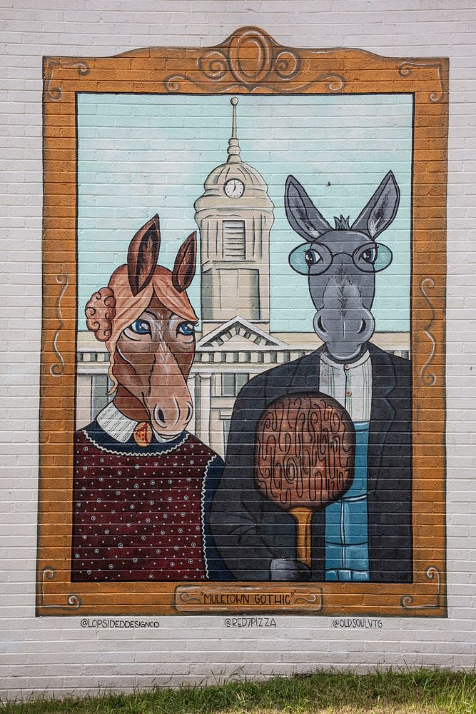                         Wall art, "Muletown Gothic" featuring two mules on a side of the Red 7 pizza restaurant in Columbia…