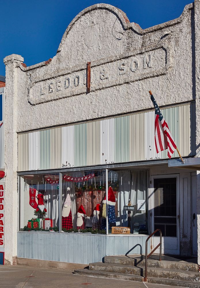                         Christmas decorations adorn this old building, now (as of 2021) a hair salon in the village of…