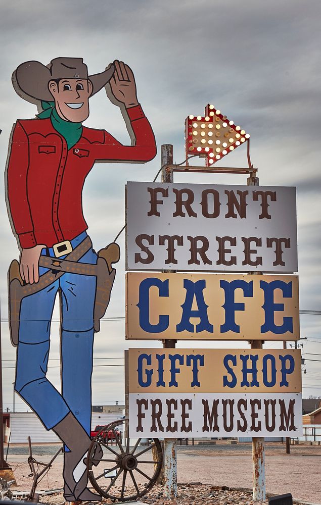                         A gigantic cowpoke character beckons passersby to Front Street, a manufactured Old West-style street…