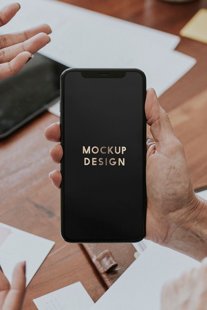 Woman holding a mobile phone screen mockup