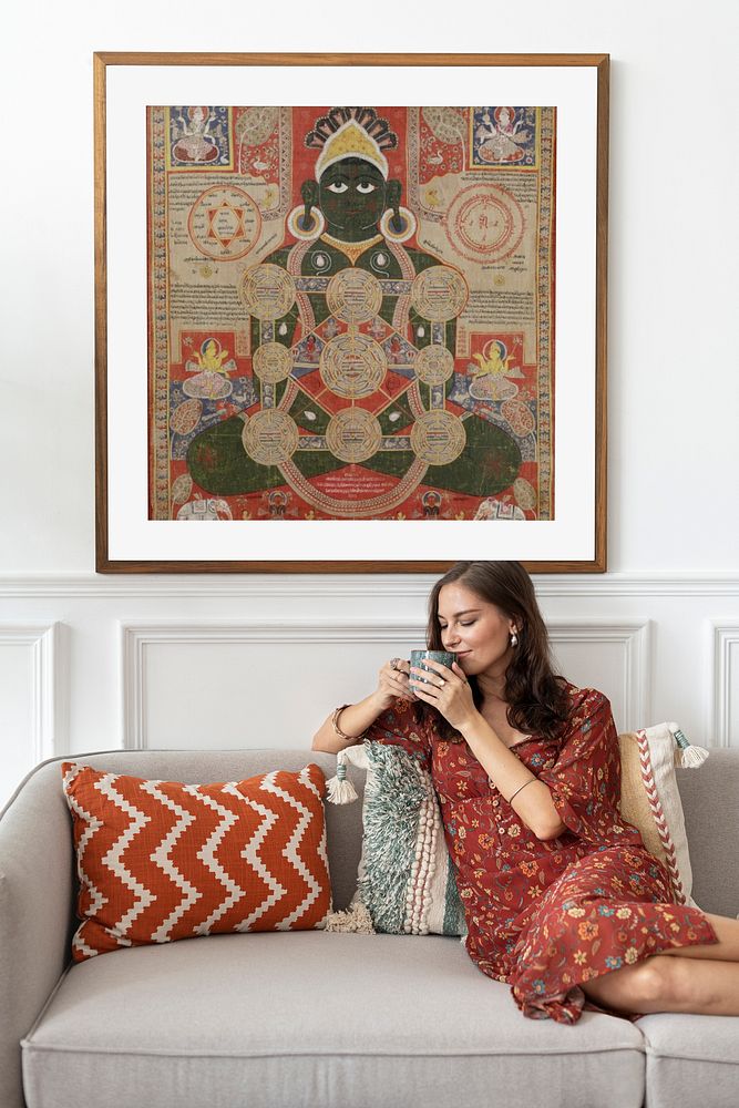 Woman drinking coffee in living room