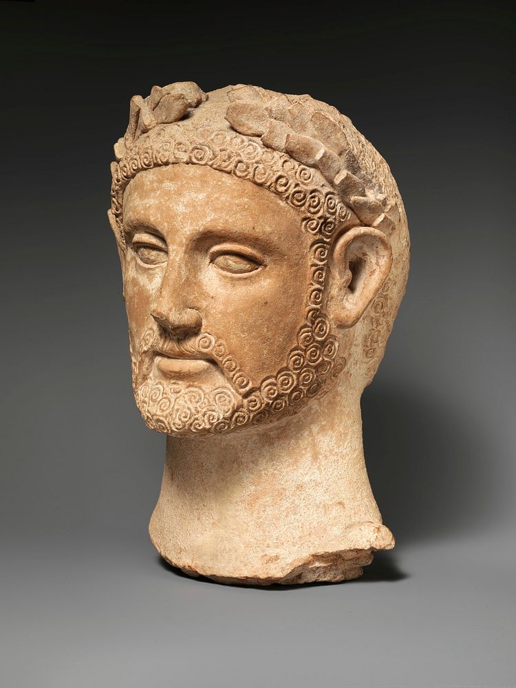 Terracotta head of a man wearing a wreath