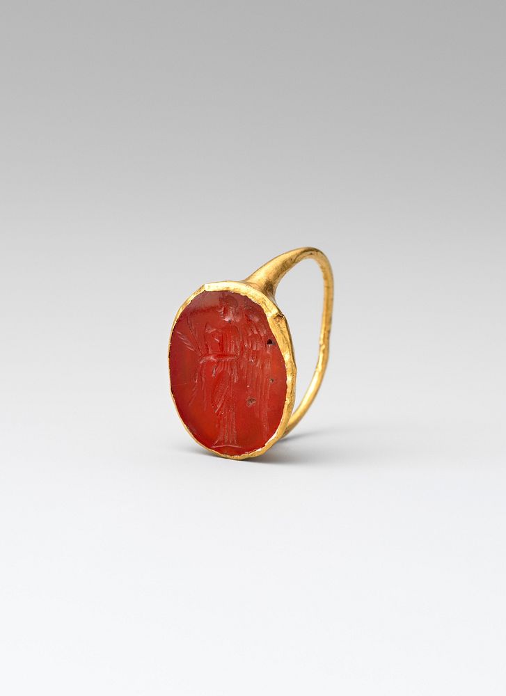 Gold ring with carnelian intaglio: winged Nemesis