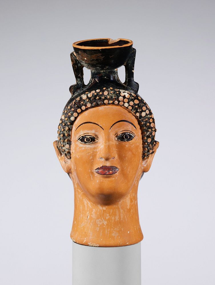Terracotta aryballos (perfume bottle) in the shape of a woman's head