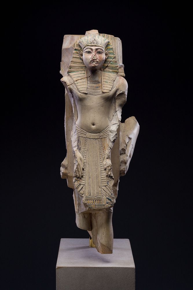 Figure of a king as part of a group proffered by an official of Ramesses II