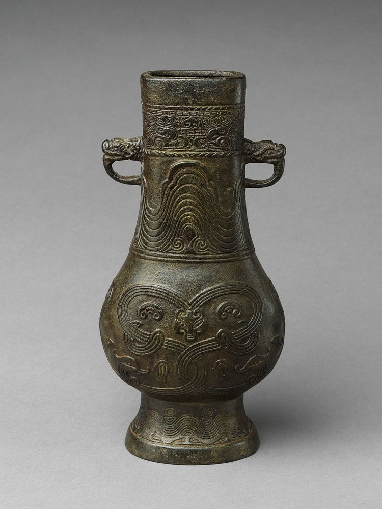 Flower vase with animal-head handles