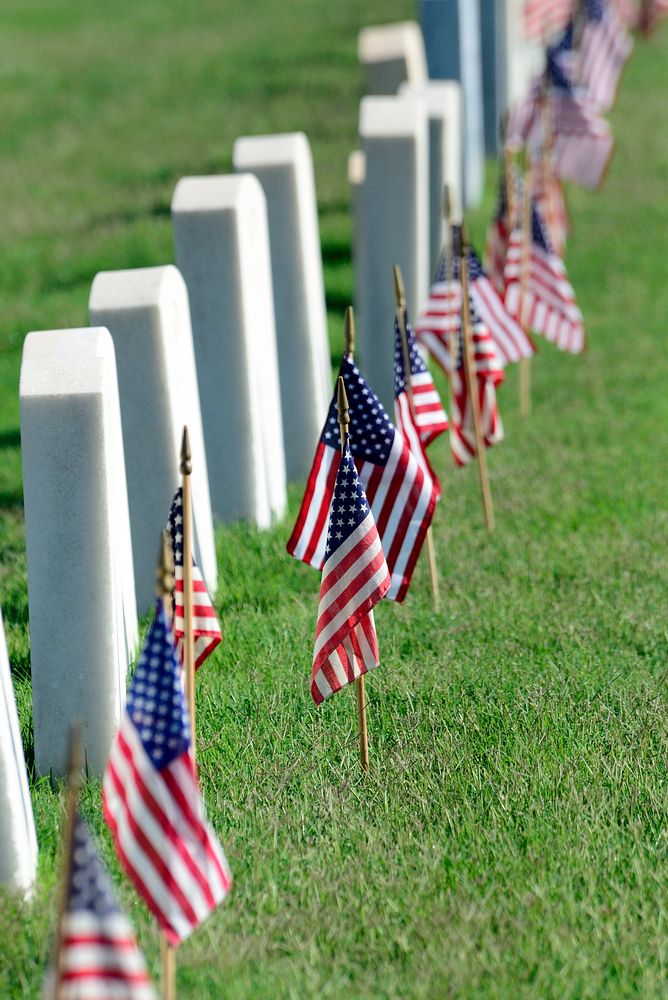 Fort Sill Post Cemetery was decorated with American flags. Original public domain image from Flickr
