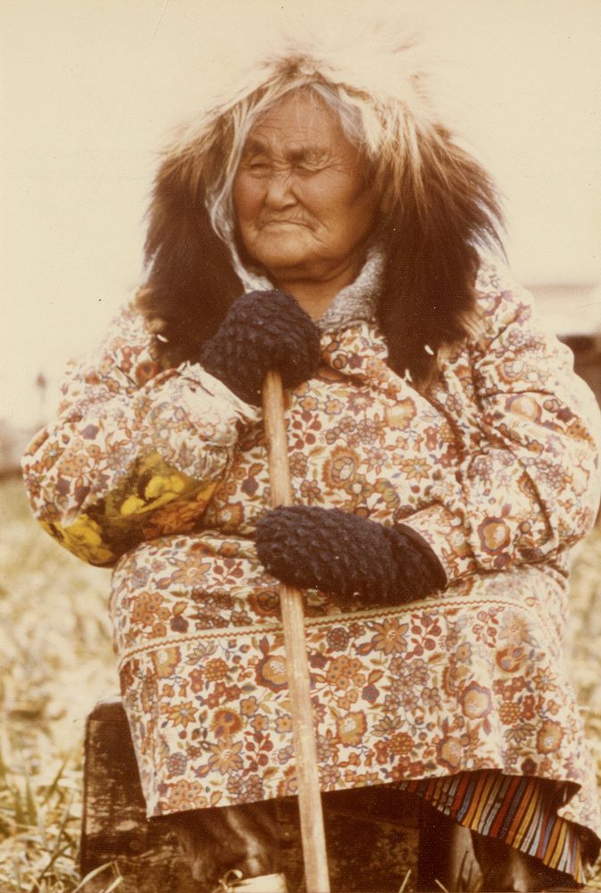 Elderly Eskimo lady in traditional wolverine parka ruff. Original public domain image from Flickr
