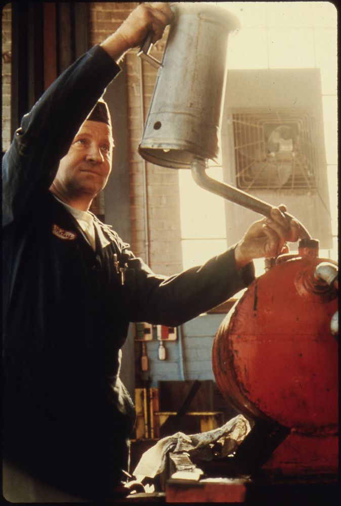 Wallace "Whitey" Wolf at Work at the Repair Garage for the City. He Also Is an Officer in the Volunteer Fire Department.