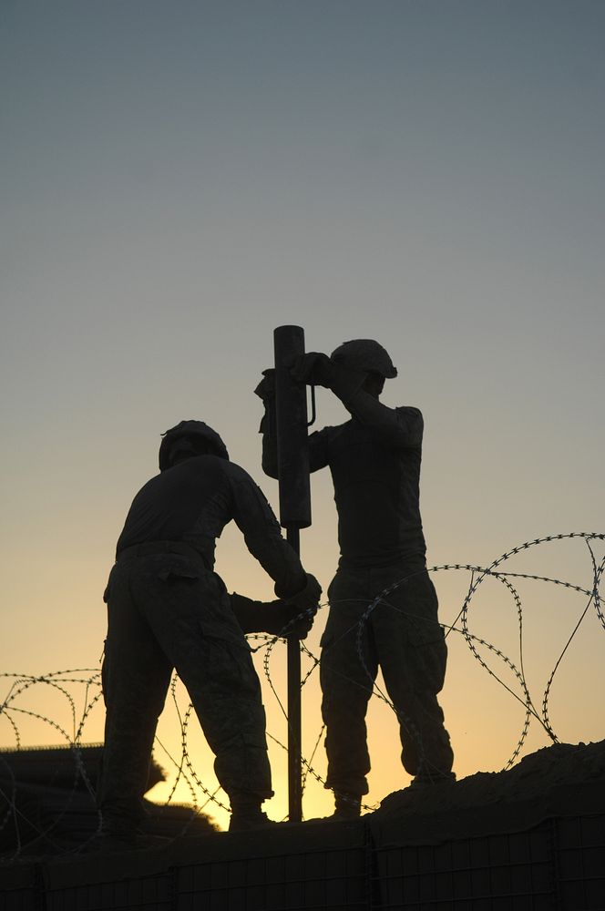 U.S. Soldiers from the 5th Stryker Brigade Combat Team, 2nd Infantry Division construct an Afghan Highway Police checkpoint…