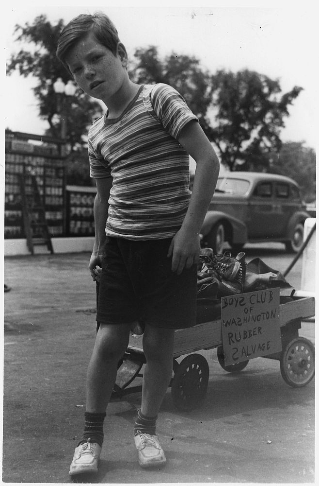 A Member of the Washington, D. C. Boys Club Wheels in a Load of Old Sneakers and Arctics to Add to the Nation's Scrap Rubber…