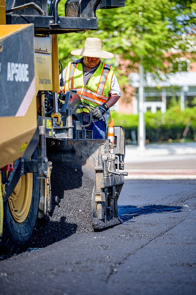 Construction crews lay down new layers of asphalt along Reade Circle as the work near the Evans Street intersection nears…