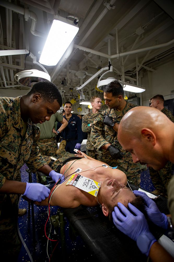 US Navy Sailors conduct a simulated mass casualty drill in response to a helicopter raid training exercise 210618-M-TS451…