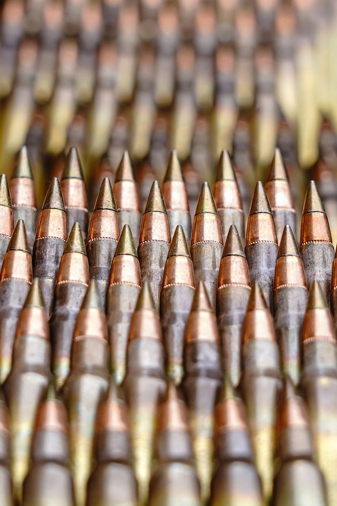 Ammunition is seen stacked on a table at a supply point before paratroopers assigned to Dog Company, 3rd Battalion, 509th…