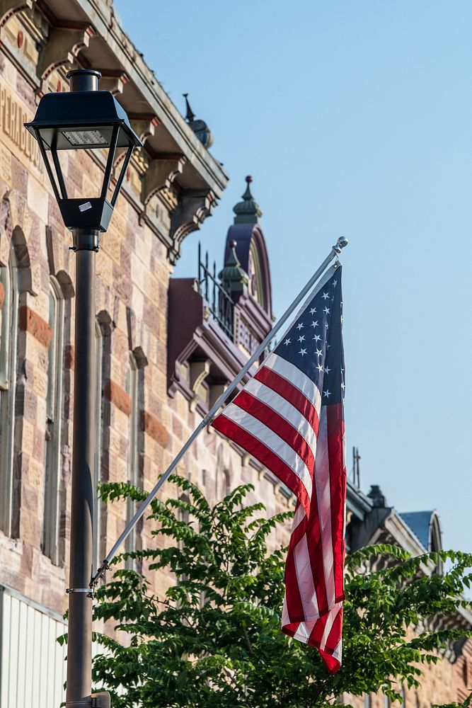 Street lamp and US Flag on Main Street. Original public domain image from Flickr