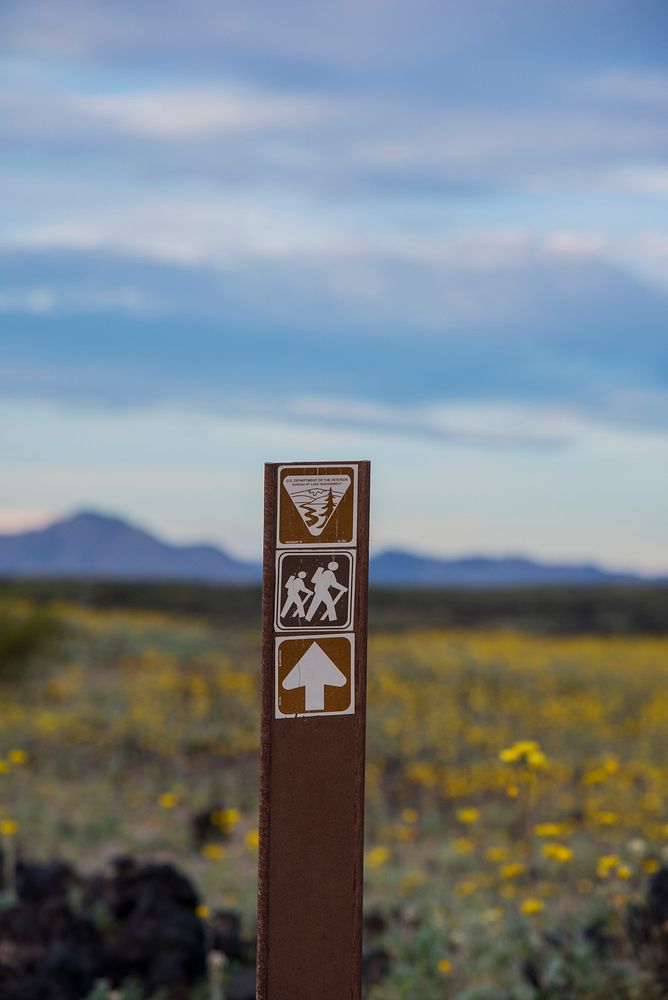 A trail marker along the trail at Amboy Crater. Original public domain image from Flickr