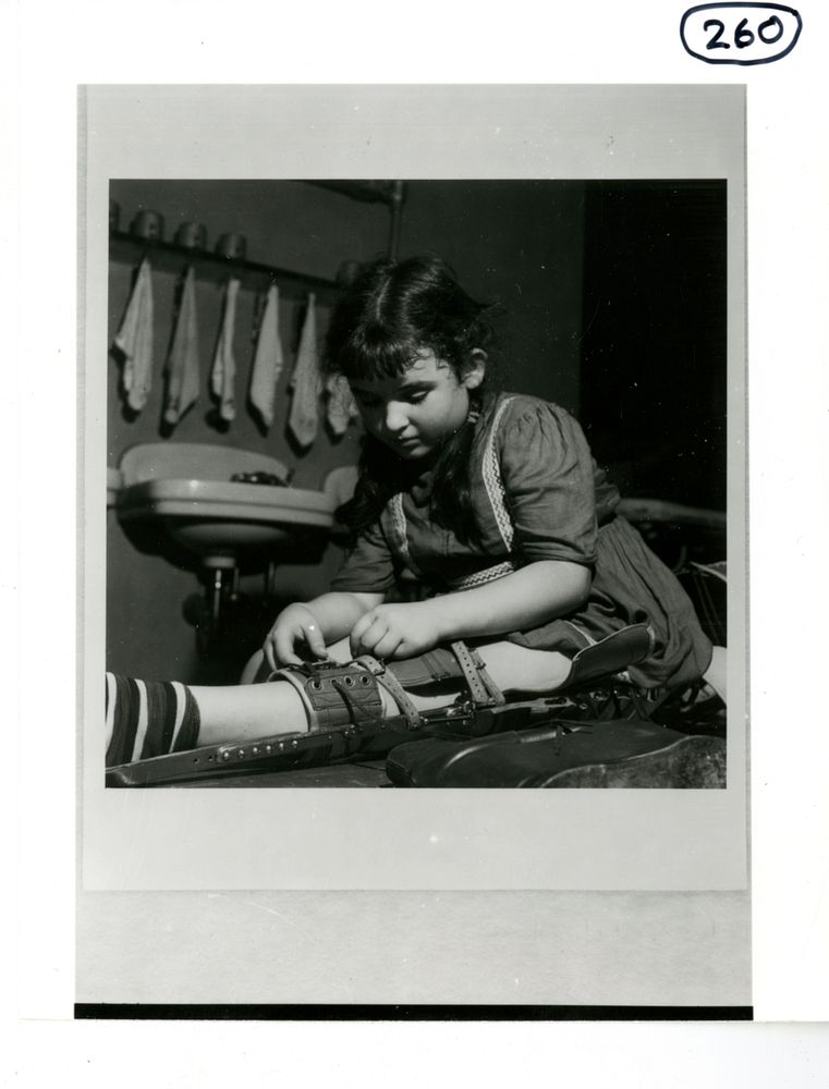 Pretty little girl adjusts a brace on her legCollection:Images from the History of Medicine (IHM)Subject(s):Orthopedic…