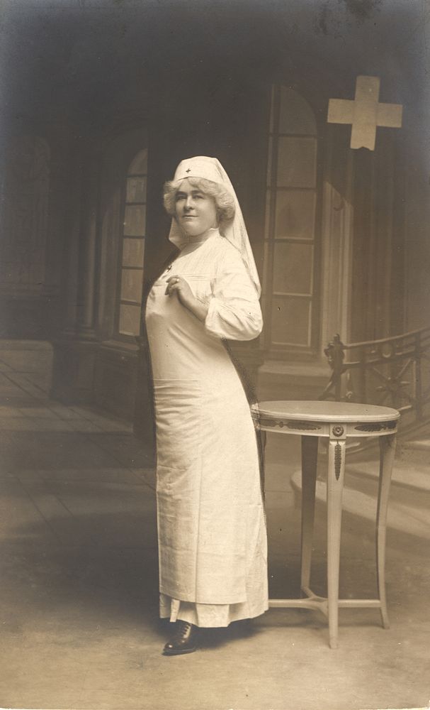 Nurse Standing in Front of a Table 