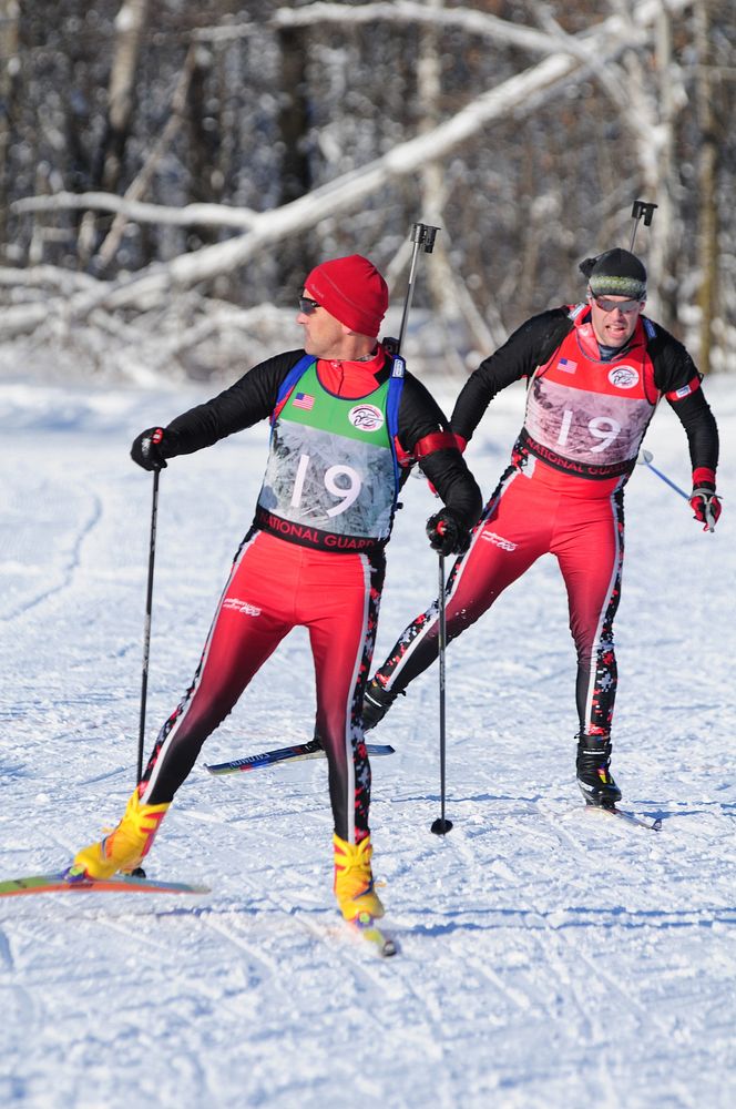 U.S. Air Force Capt. Eric Nordgren, right, with the North Dakota Air National Guards 119th Wing, races up to U.S. Army Sgt.…