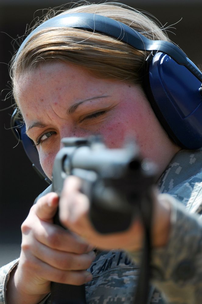 Airman 1st Class Chelsea E. Justice, a member of the 130th Airlift Wing Security Forces squadron, aims an M870 Shotgun while…