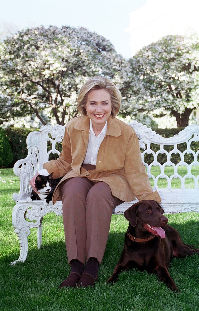 Photograph of First Lady Hillary Rodham Clinton with Socks the Cat and Buddy the Dog: 04/07/1999. Original public domain…