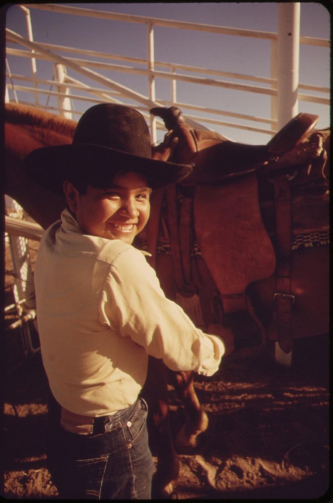 Smiling participant in the "junior rodeo", sponsored by the Parker Indian Rodeo Association and held on the Colorado River…