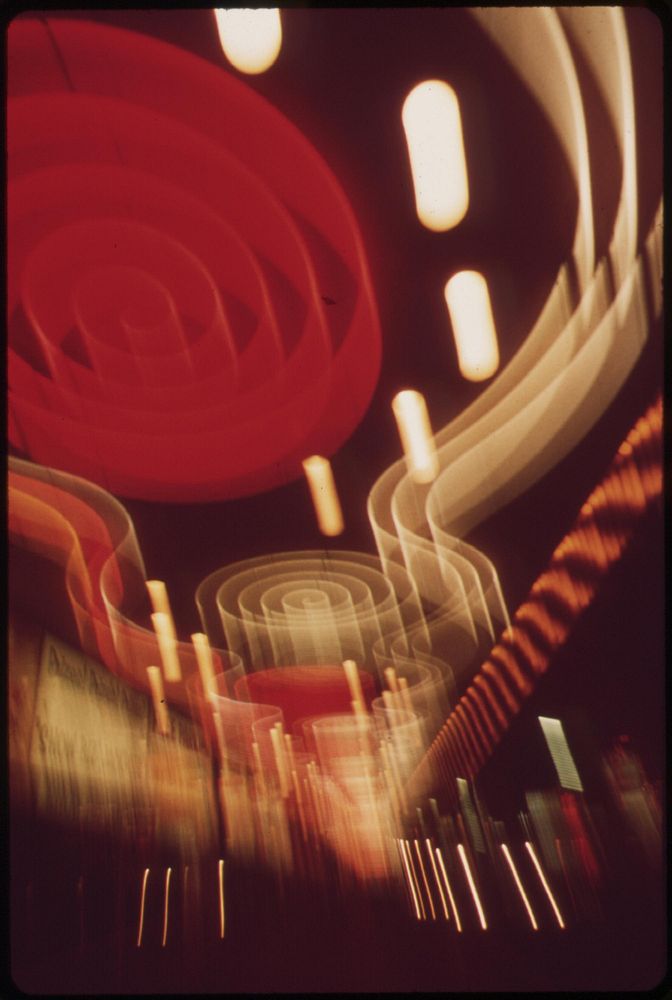 Light patterns created by multicolored casino displays in downtown Las Vegas, May 1972. Photographer: O'Rear, Charles.…