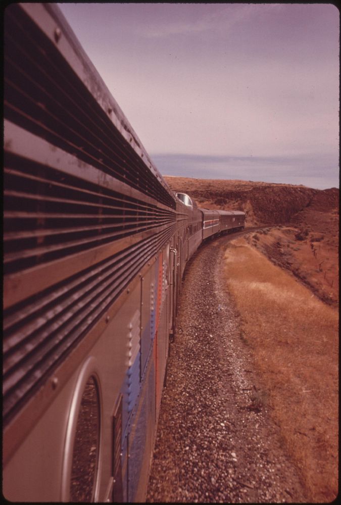 Expo '74 passenger train rounds a curve near Wenatchee Washington, enroute from Spokane to Seattle, June 1974. Photographer:…