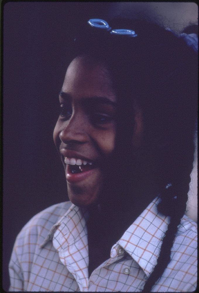 A Black Girl Pictured While Shopping With Her Family On 47th Street On Chicago's South Side, 06/1973. Photographer: White…