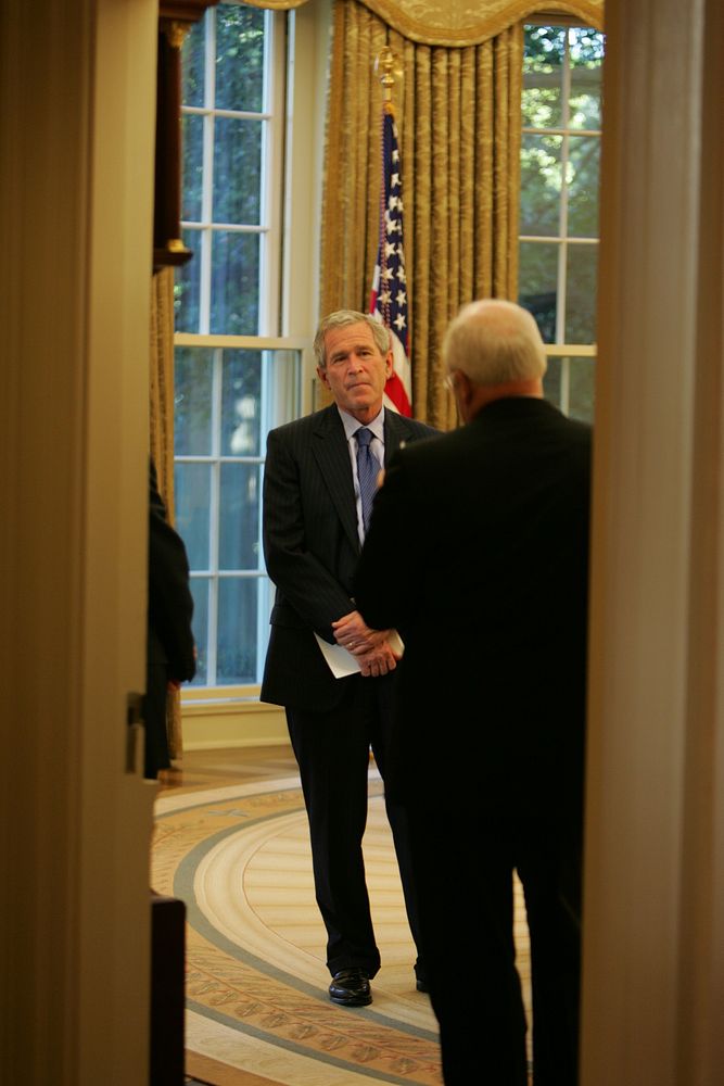Vice President Cheney Speaks with President Bush in the Oval Office. Original public domain image from Flickr