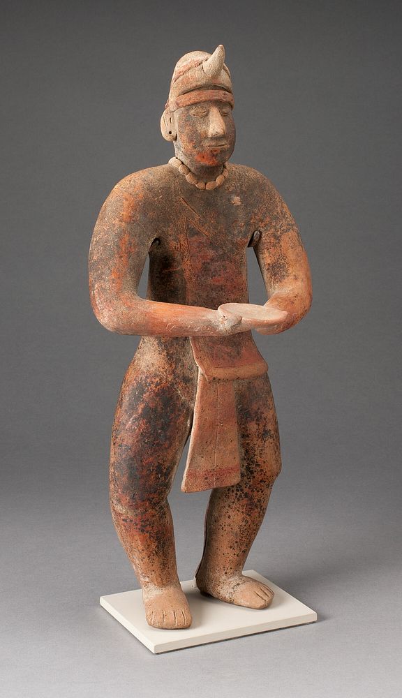 Standing Male Figure Holding a Plate by Colima