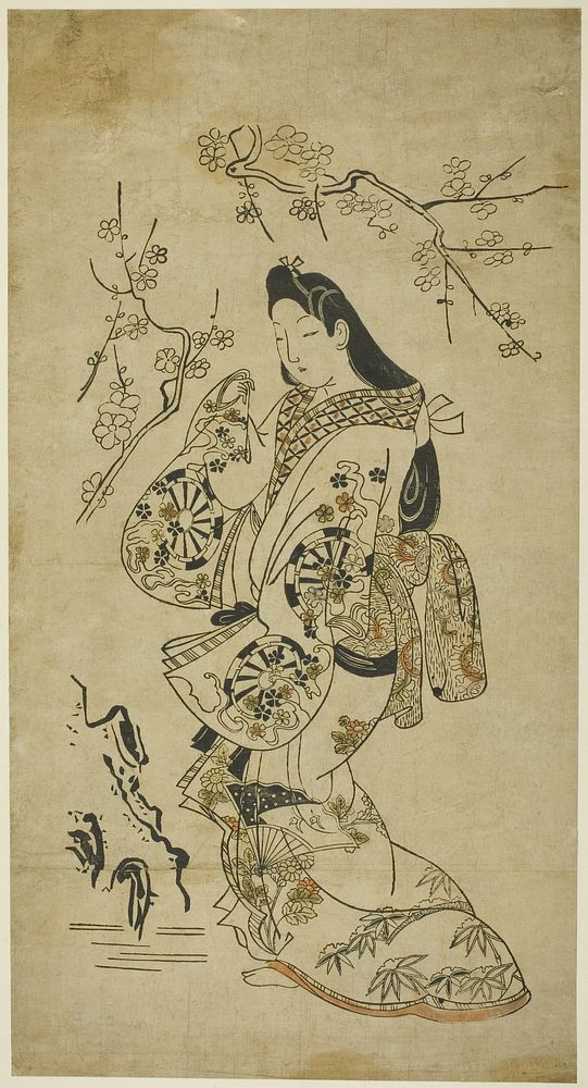 A Young Woman Walking near a Plum Tree