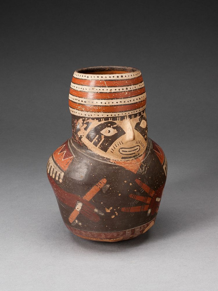 Jar in the Form of a Warrior Holding a Club and Other Weapons by Nazca