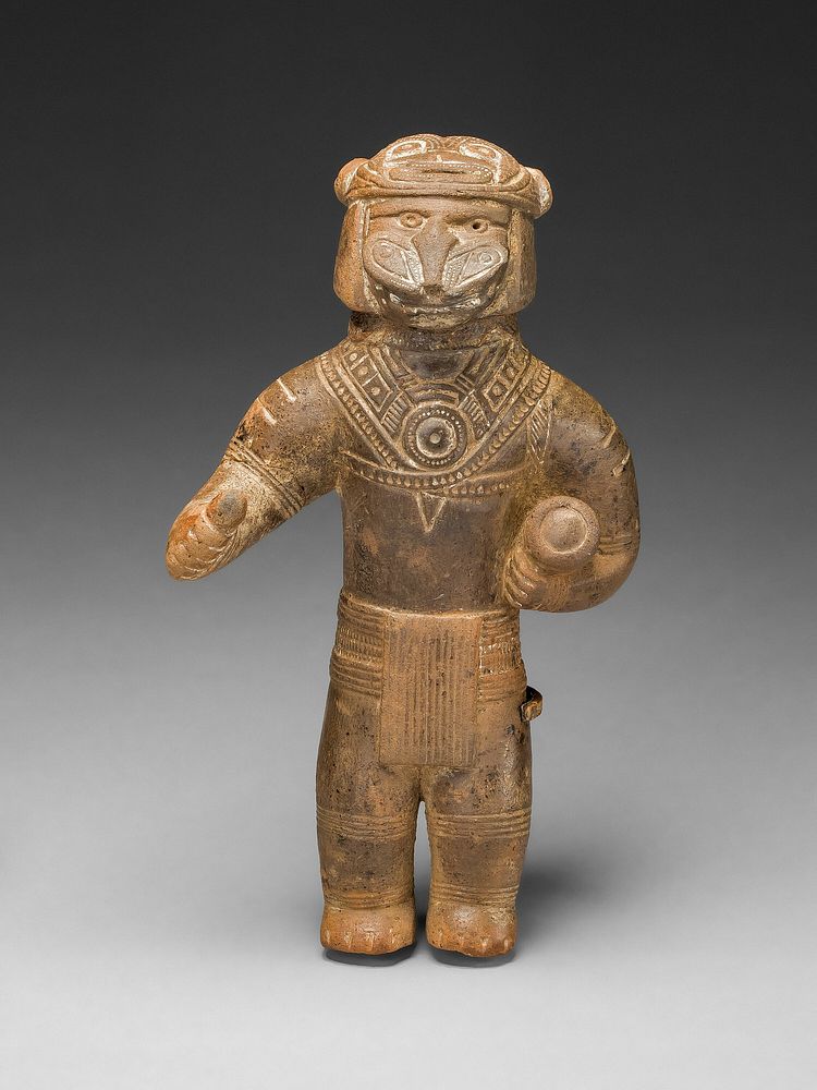 Masked Figurine Holding a Drum, Possibly an Ocarina (Whistle) by Tairona