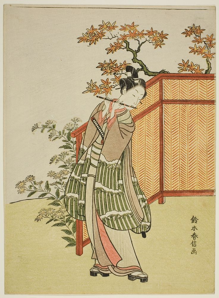 Young Man Playing the Flute Beside a Fence by Suzuki Harunobu