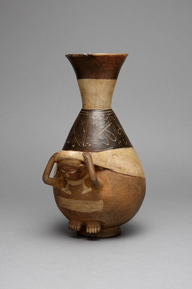 Bottle in Form of a Figure Carrying a Burden with a Tumpline by Moche