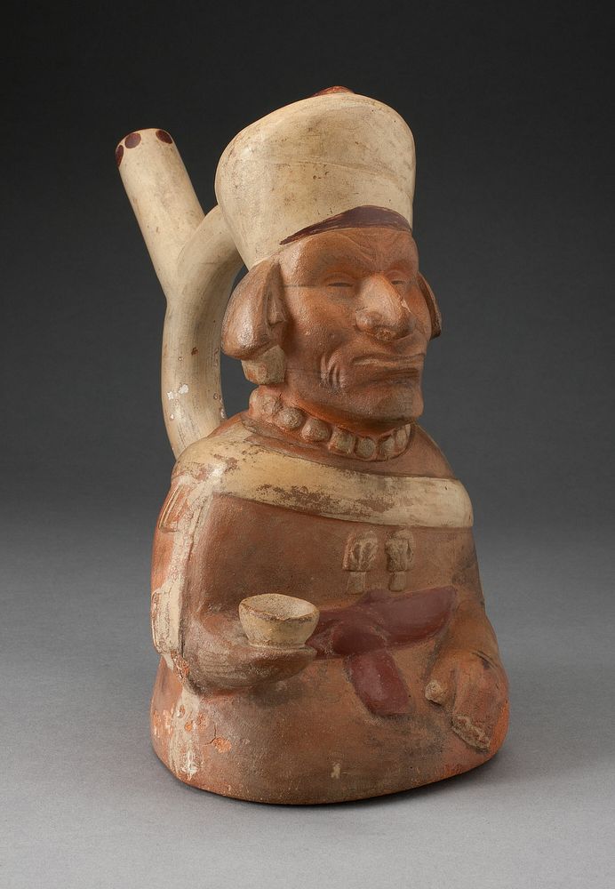 Handle Spout Vessel in the Form of Blind Man Holding a Cup by Moche