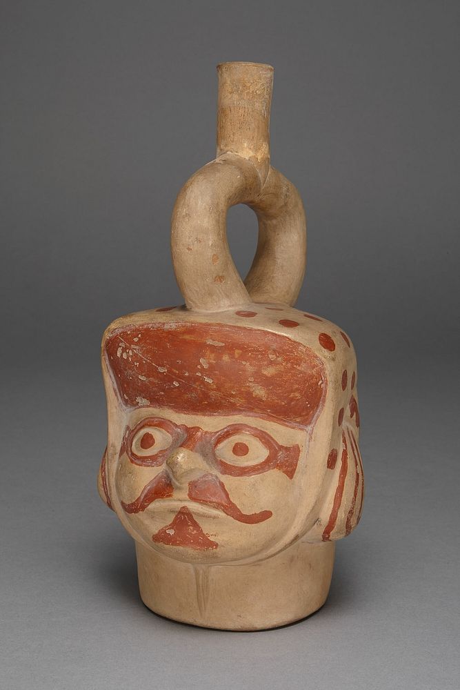 Vessel in Form of a Masked Head with a Mustache by Moche