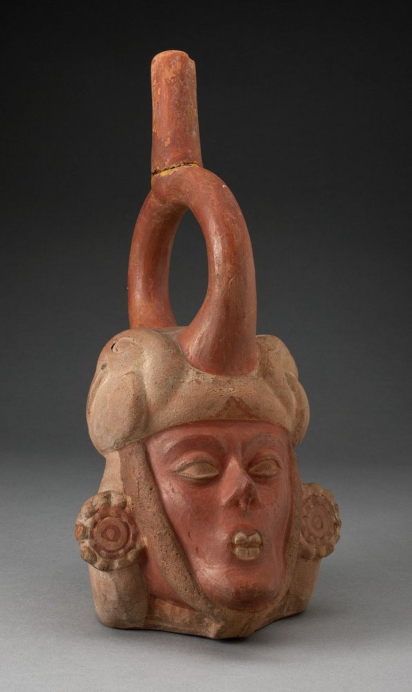 Portrait Vessel of a Ruler with a Skeletal Face and Ornate Earings by Moche