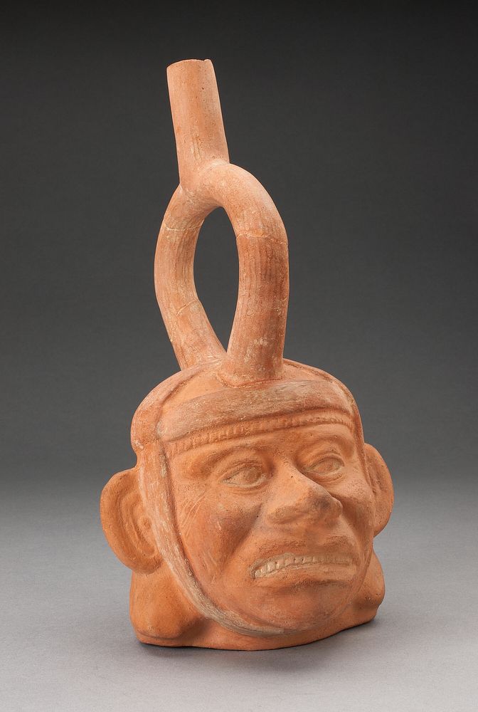 Portrait Vessel of a Figure with Grimacing Face by Moche