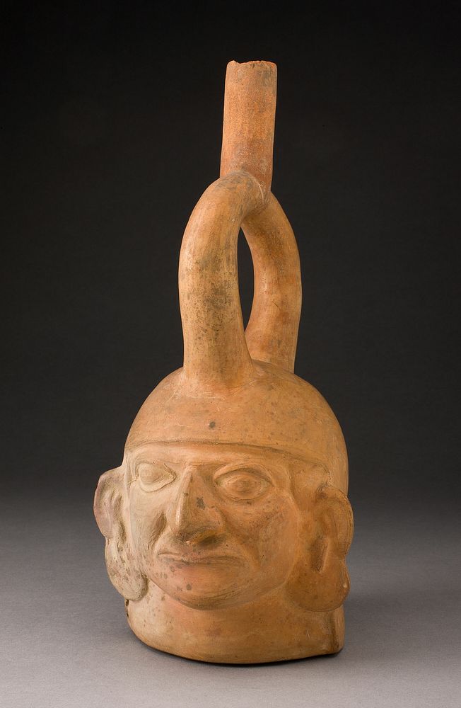 Portrait Vessel of a Figure with Large Disk Earflares by Moche
