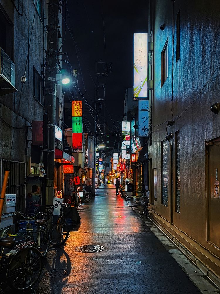 Urban Alley at Night, Tokyo, JapanLooking down a typical decaying and grungy urban alley at night in central Tokyo, Japan.